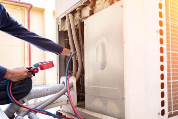 technician checking commercial unit