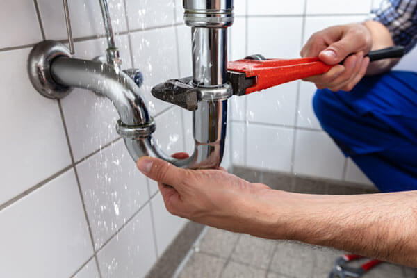 Technician working on plumbing