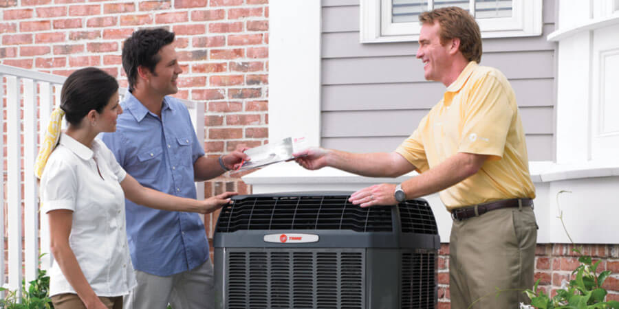 Trane technician talking with customers